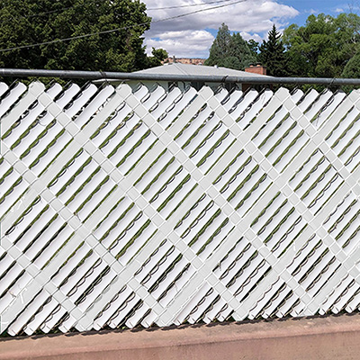 White Chain Link Aluminum Privacy Slats installed on chain link fence